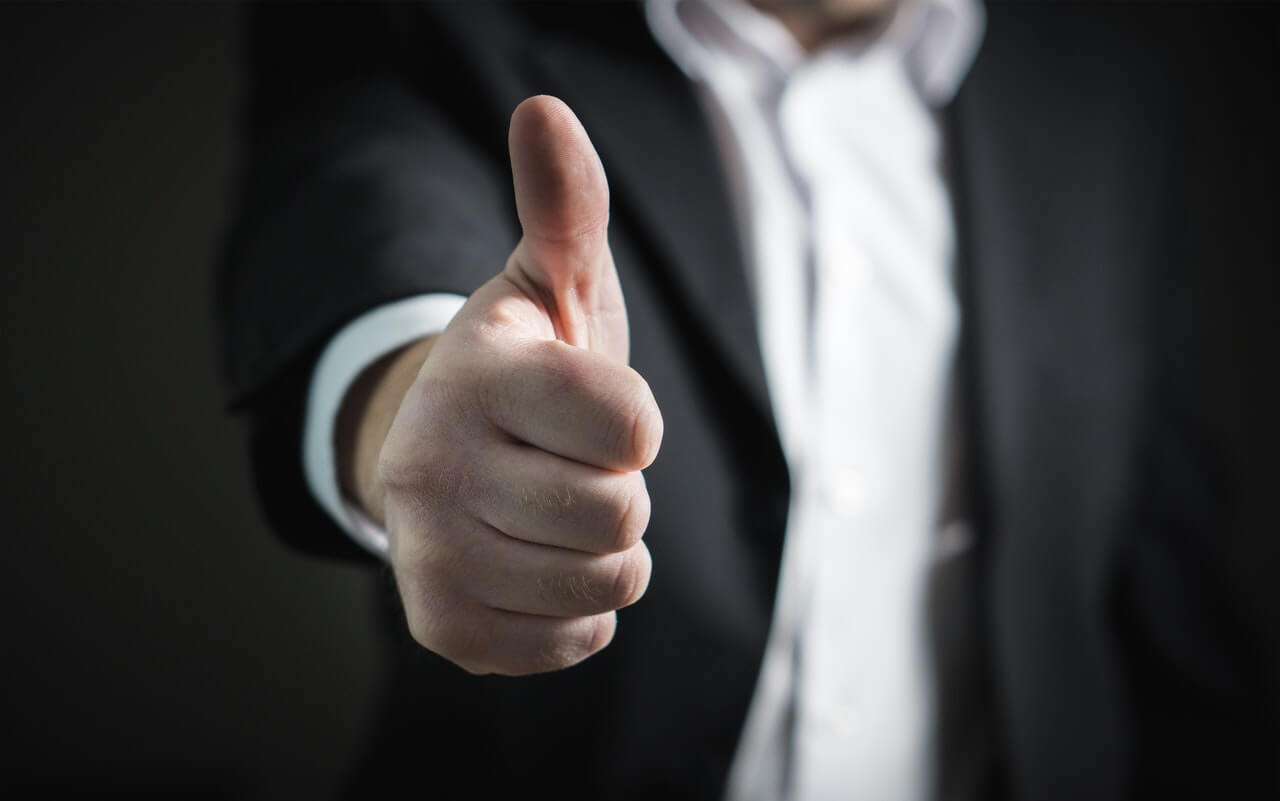 man doing a thumbs up gesture