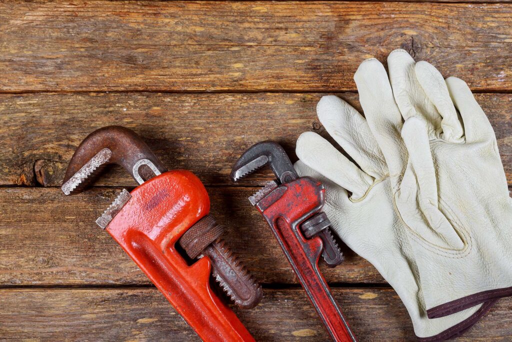gloves and plumbing tools
